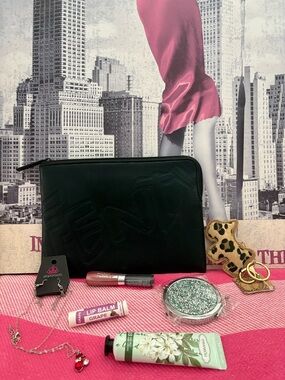 Black Embossed Cosmetic Pouch with Assorted Accessories